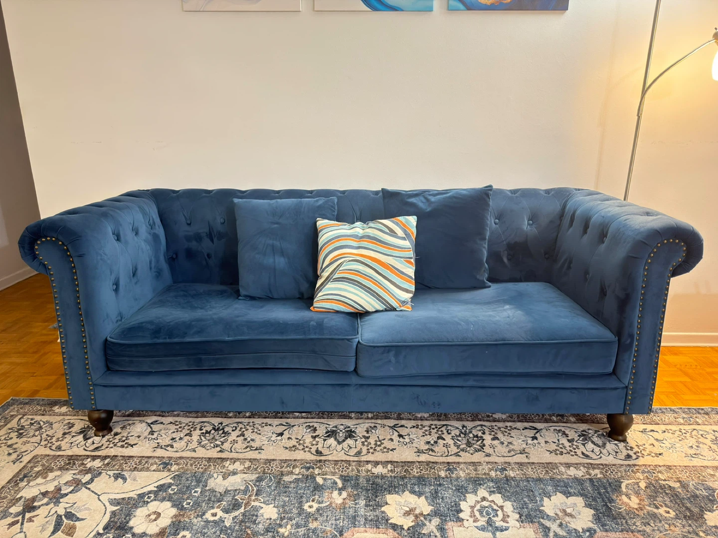 Blue Tufted Sofa with Decorative Pillows
