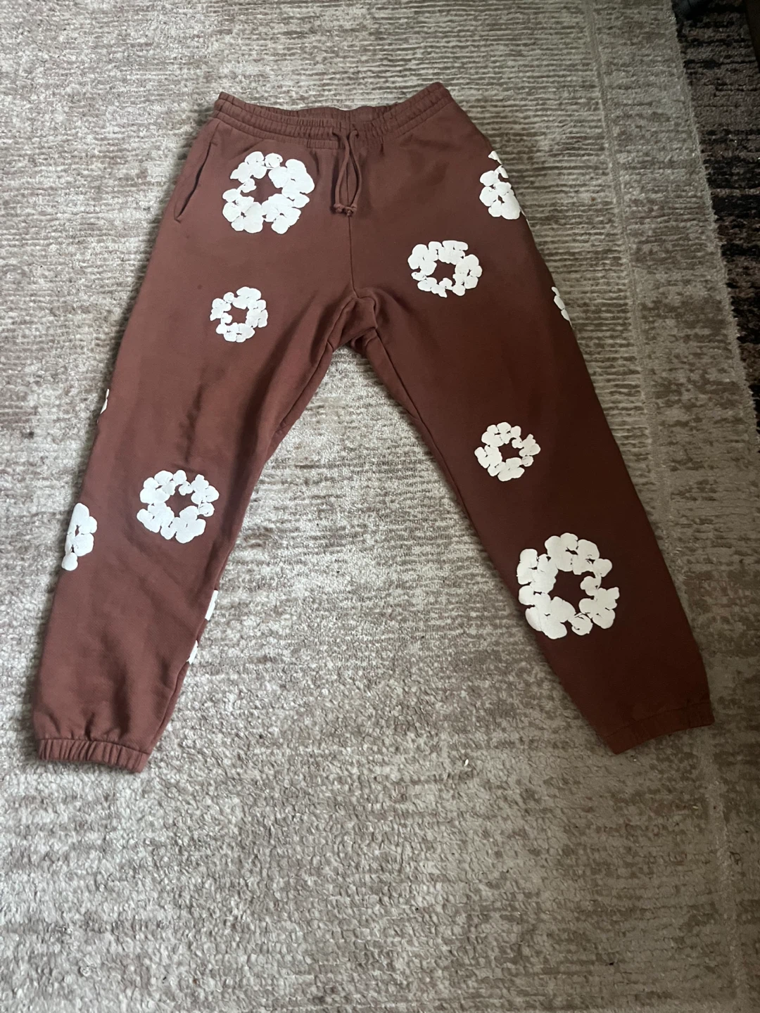 Brown  Denim tear sweatpants with white flower print