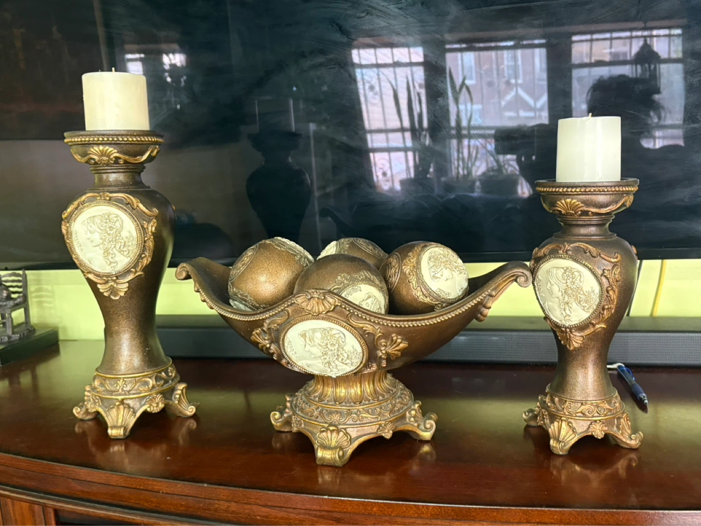 Set of 2 ornate bronze candle holders with decorative bowl