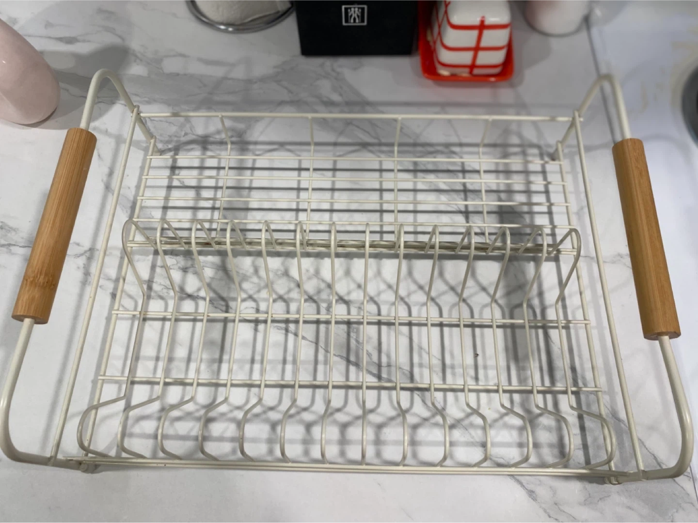 White wire dish rack with wooden handles