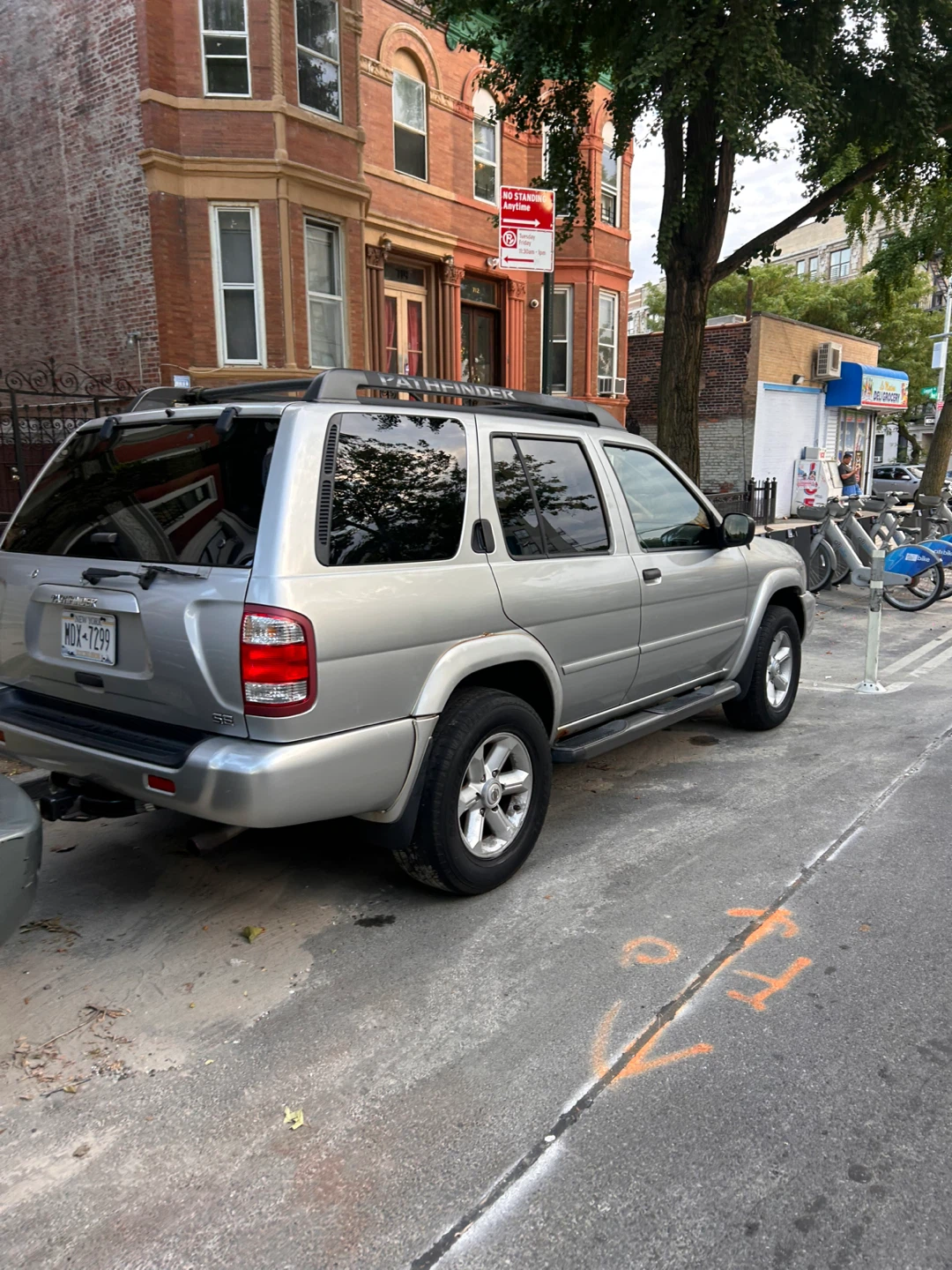 Silver Nissan Pathfinder SUV - photo 2