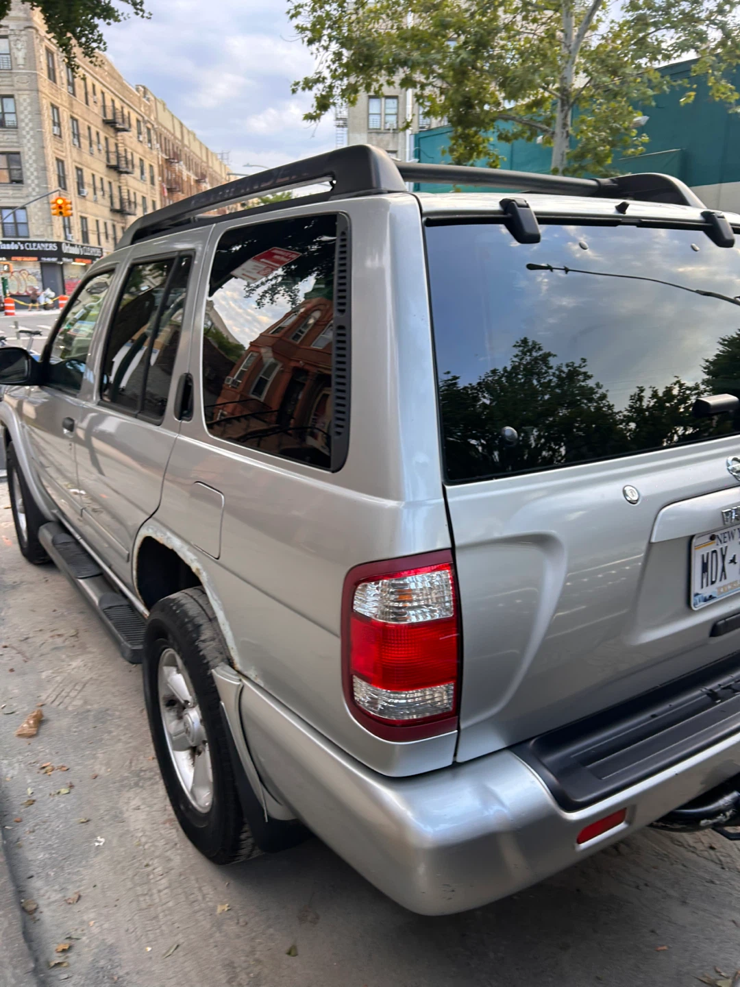 Silver Nissan Pathfinder SUV - photo 5