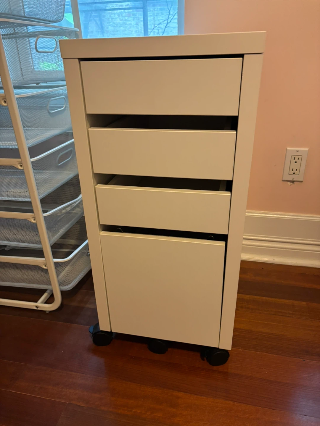 White hanging file storage unit.