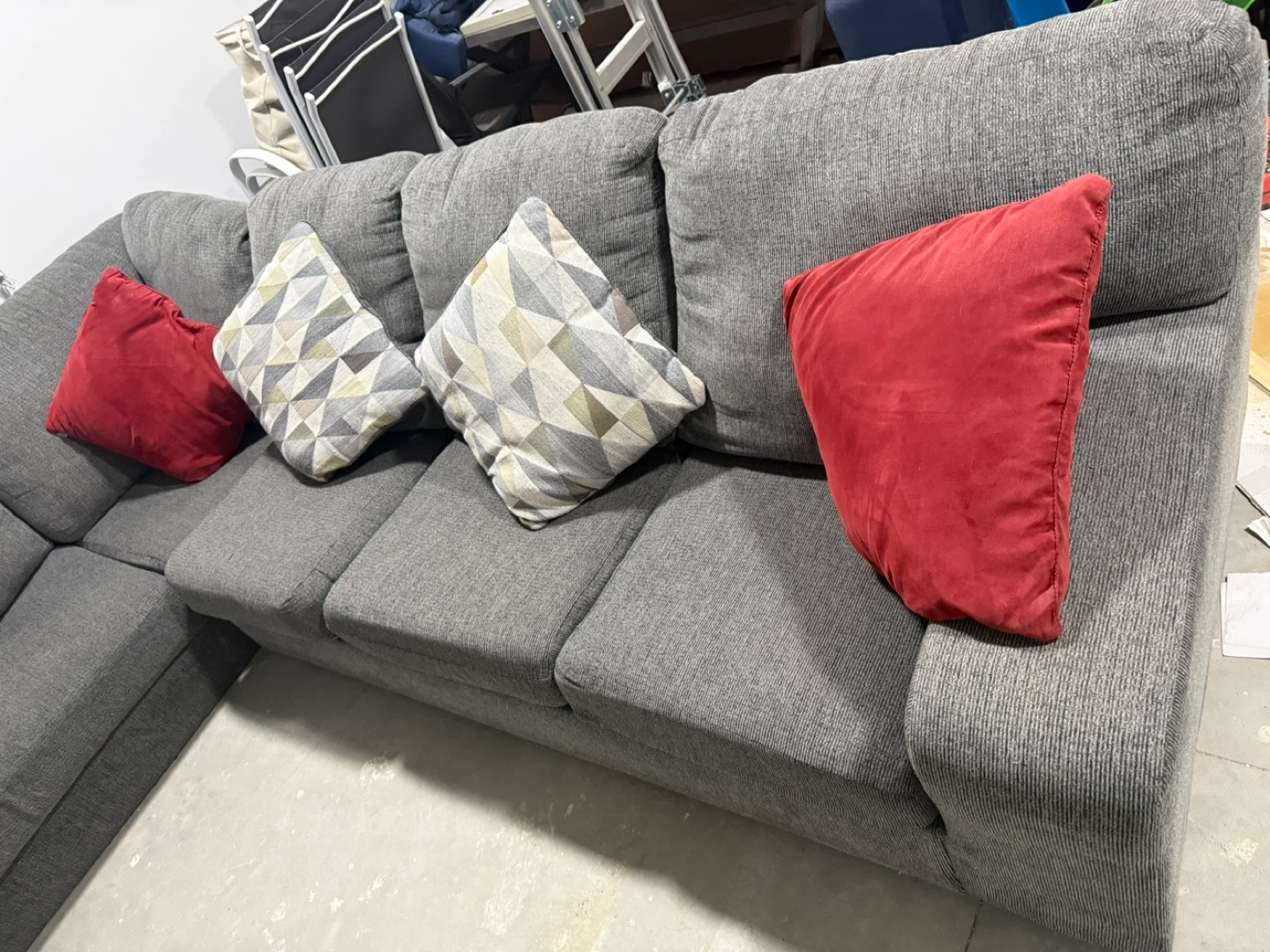 Grey Sectional Sofa with Red and Geometric Pillows
