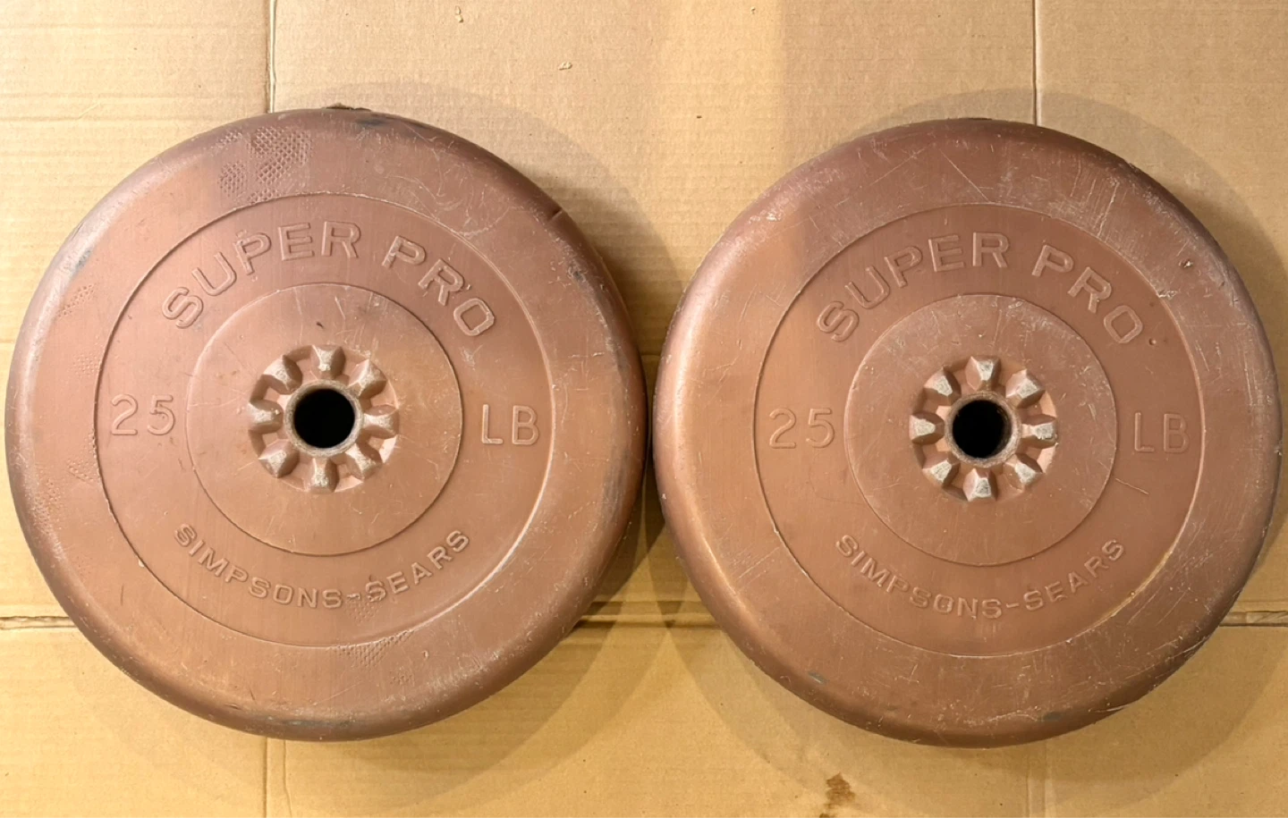 Two Super Pro 25 LB Weight Plates