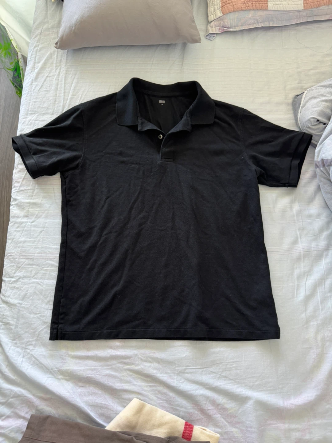 Black polo shirt for men from Uniqlo