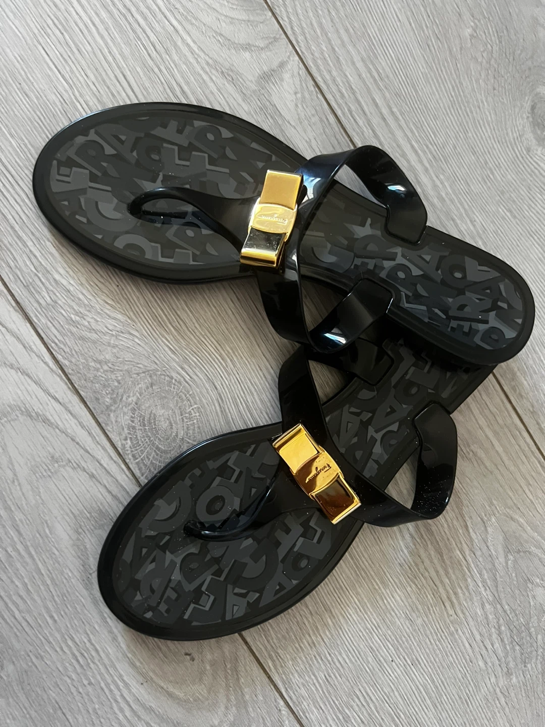 Salvatore Ferragamo Black Jelly Thong Sandals with Gold Buckle