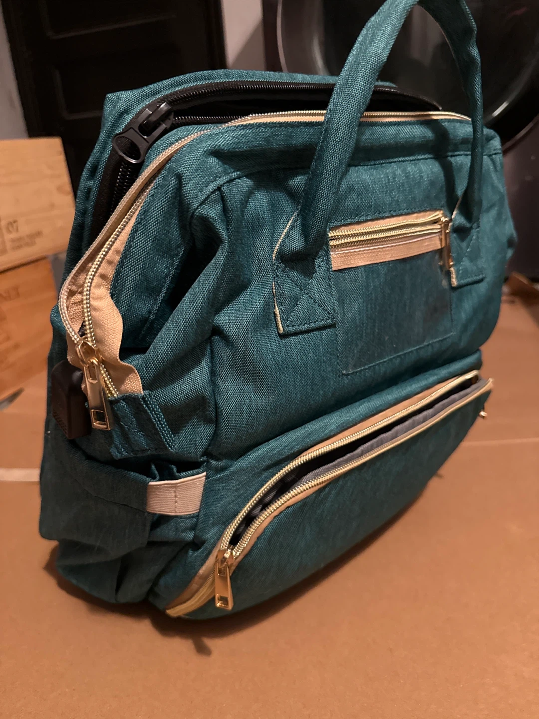 Baby Backpack with insulated bottle pouches and covered sleeper