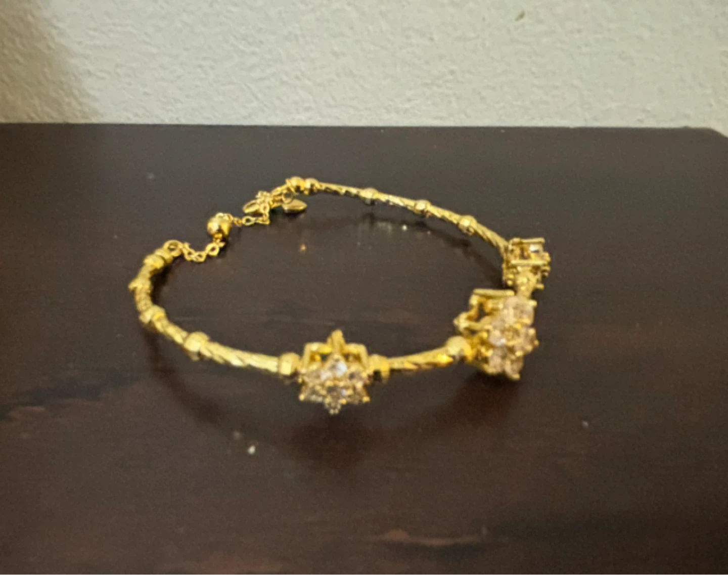 NEW-Gold-tone bracelet with clear stones