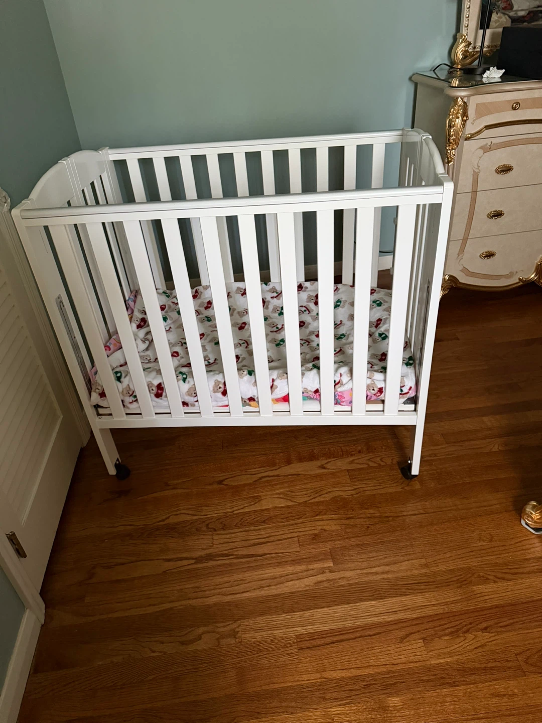 White Baby Crib with Musical Mobile