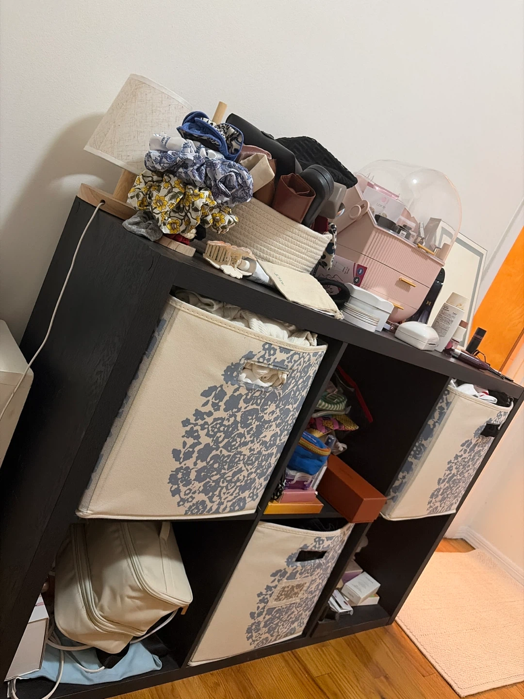 Black 6-cube organizer with 3 patterned storage bins.