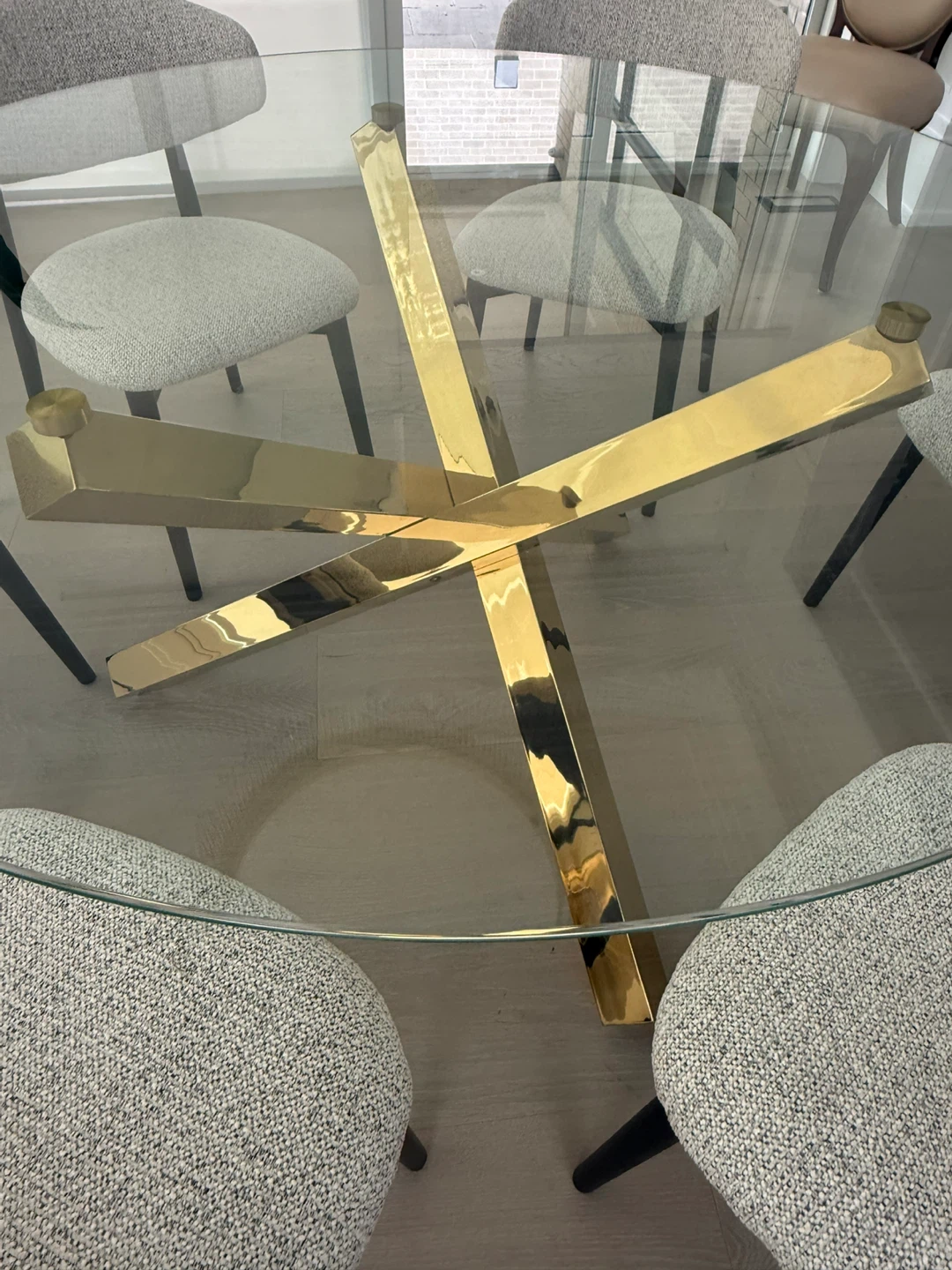 Xcella glass table with gold metal base