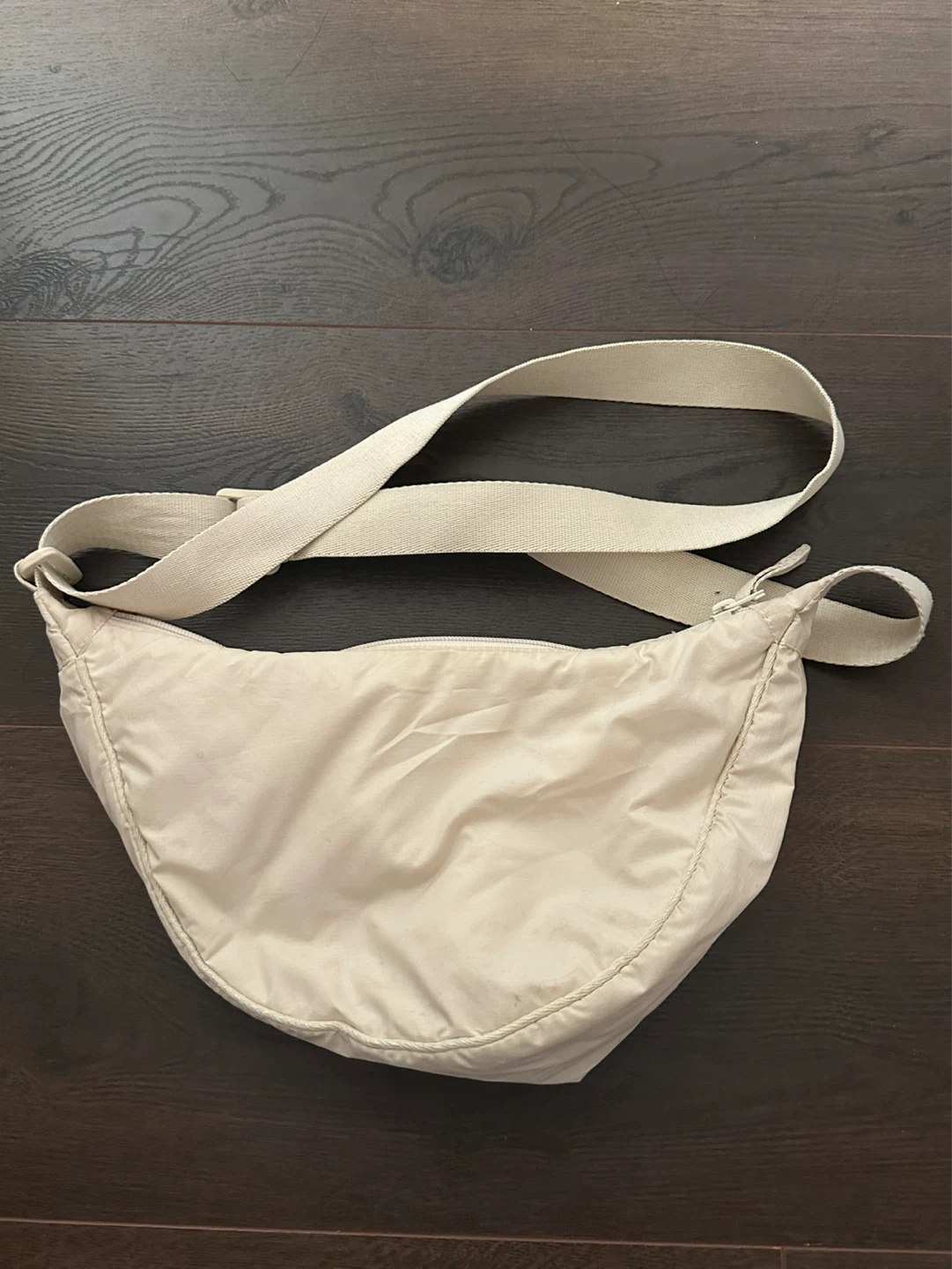 Cream coloured sling bag