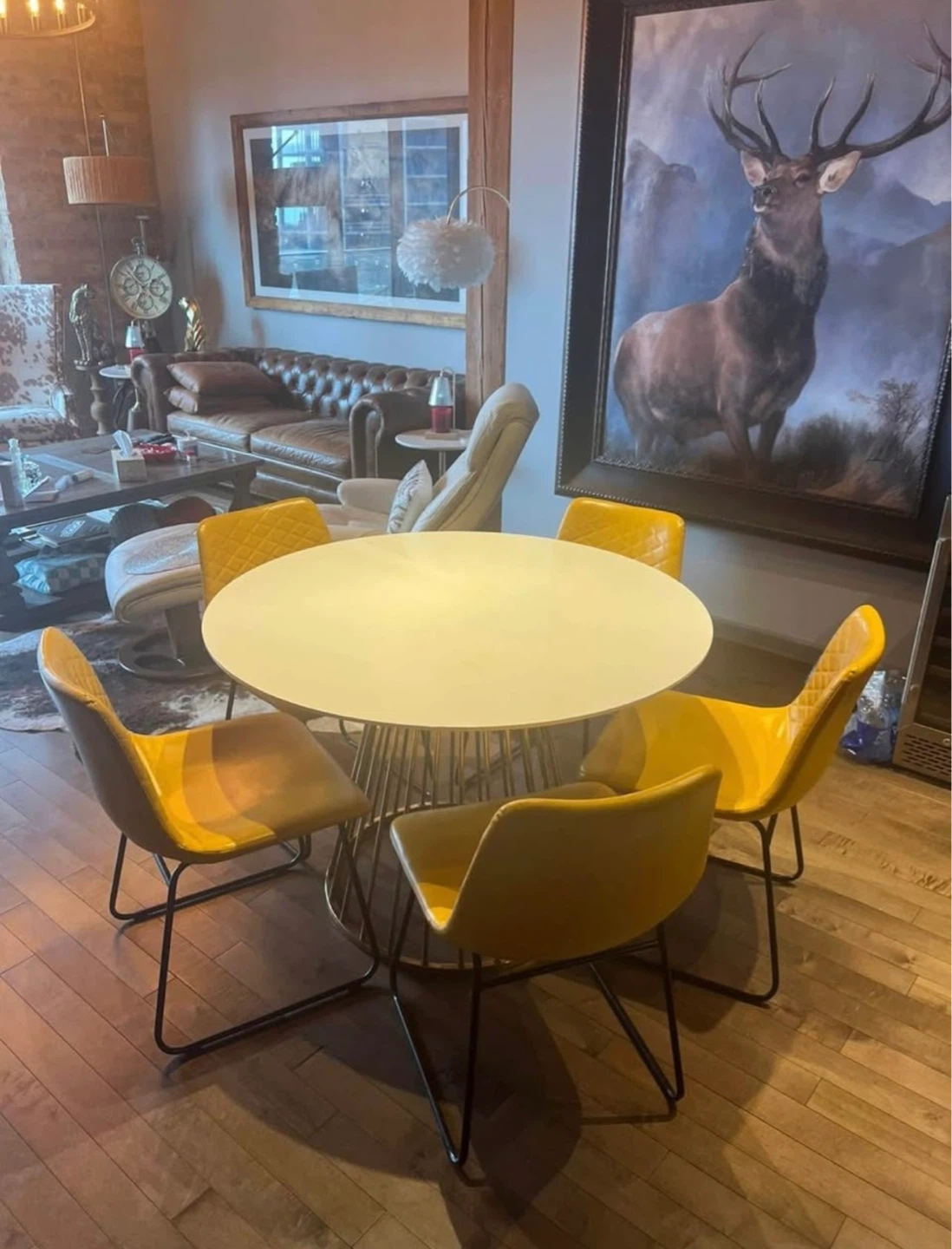 Round White Dining Table with 5 Yellow Chairs