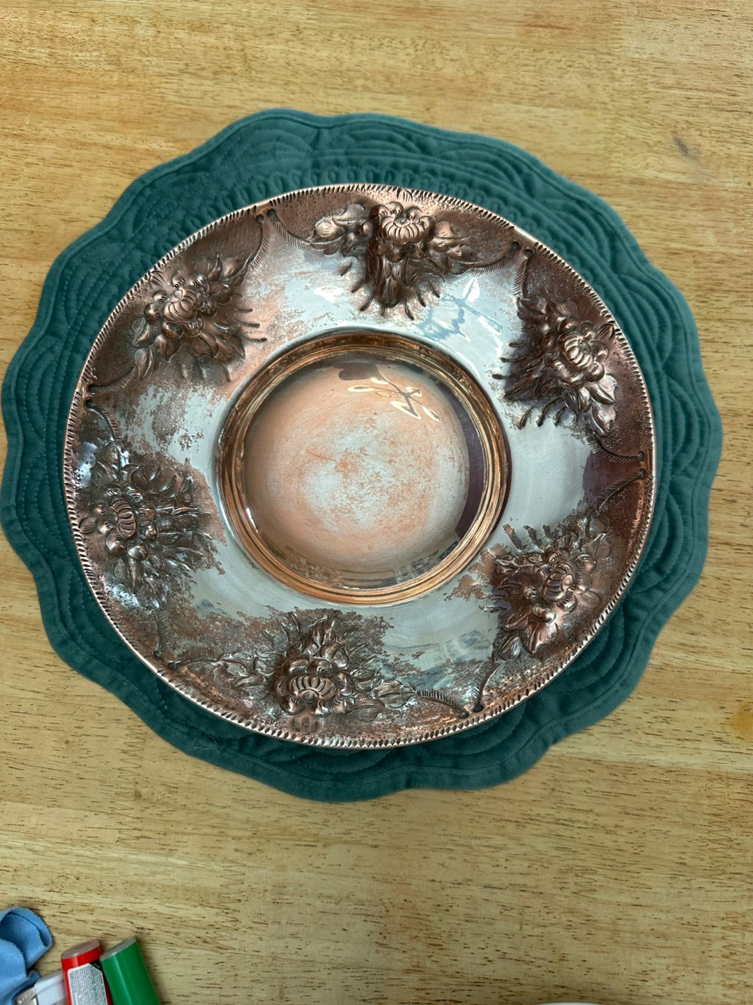 A Vintage Hammered Copper Bowl Engraved floral repoussé design.