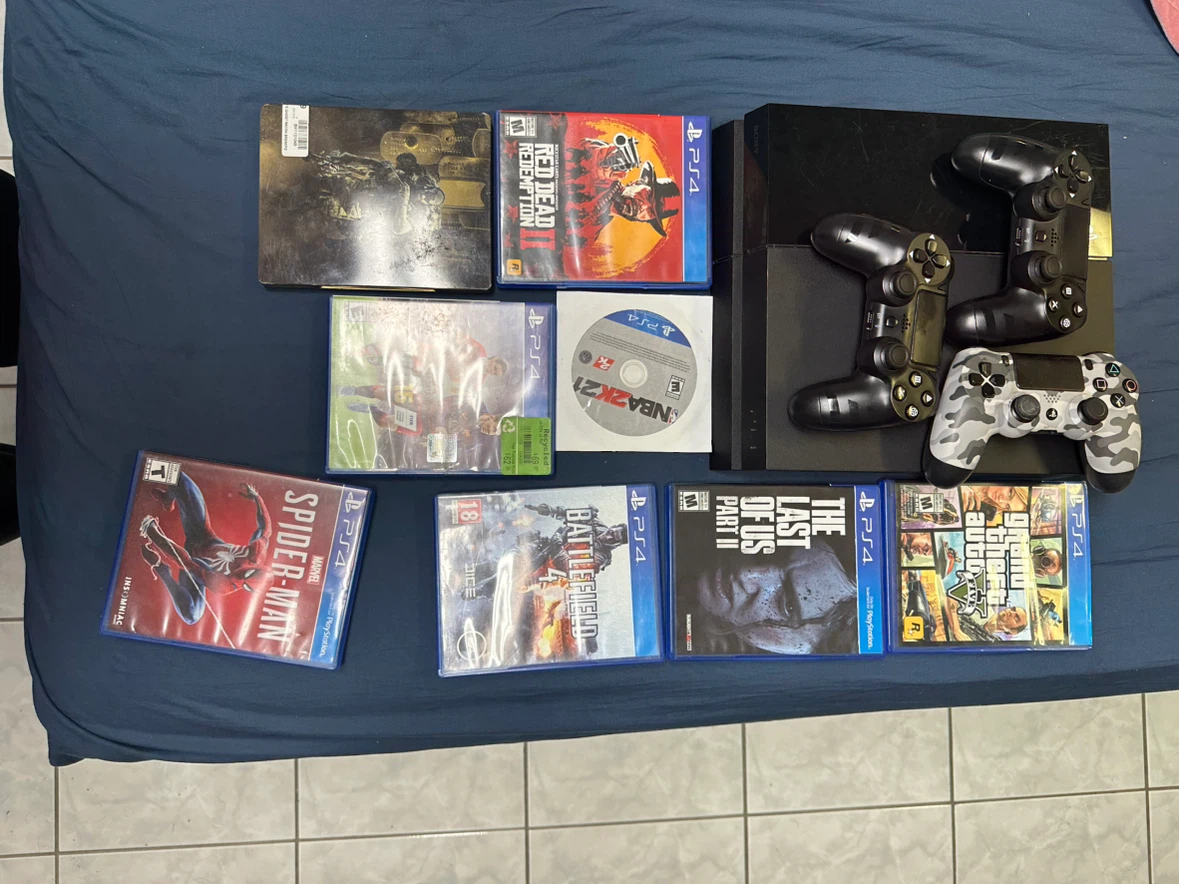 PlayStation 4 Console with 5 Games and 3 Controllers