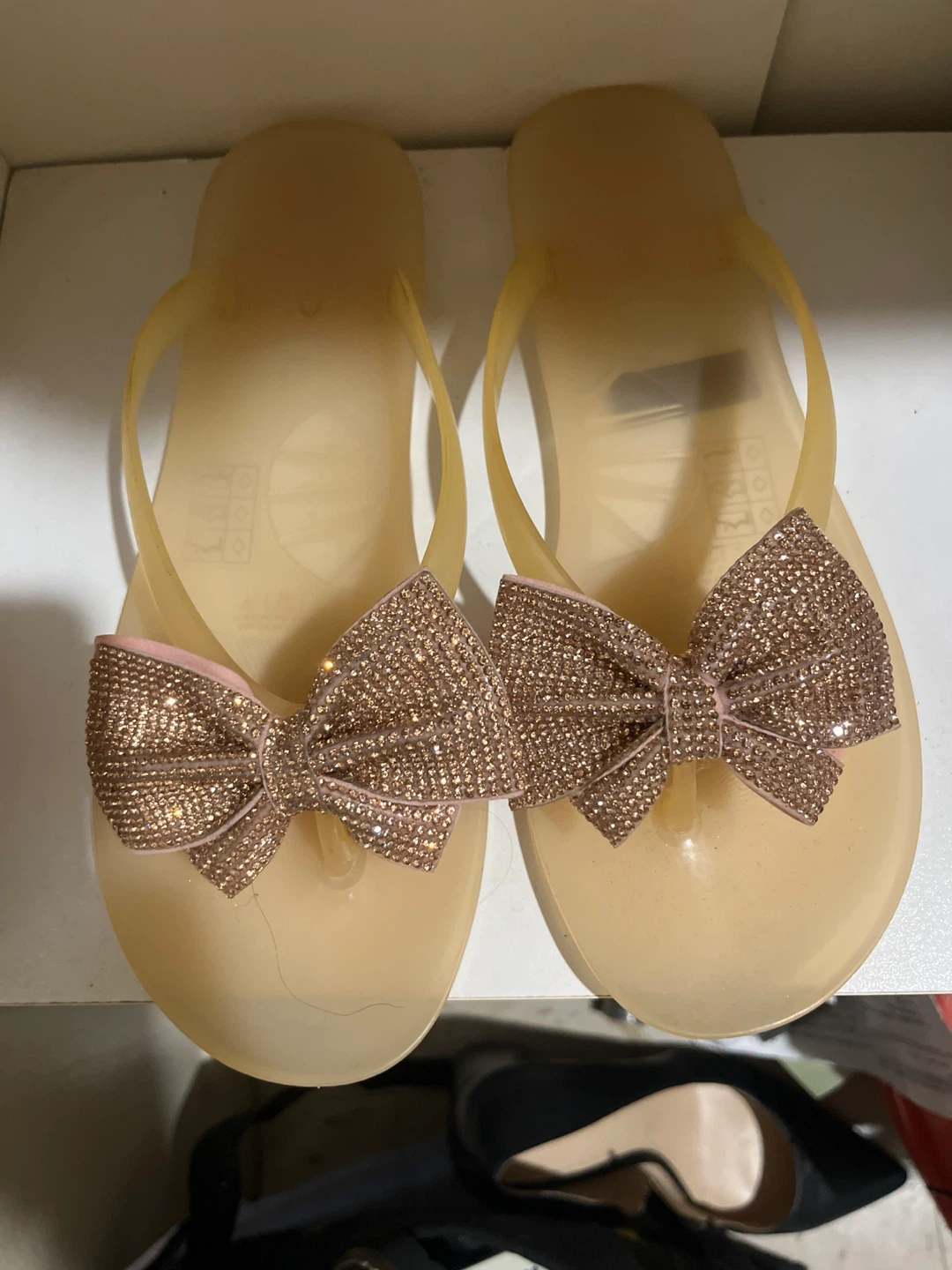 Aldo Translucent Flip Flops with Rose Gold Bows