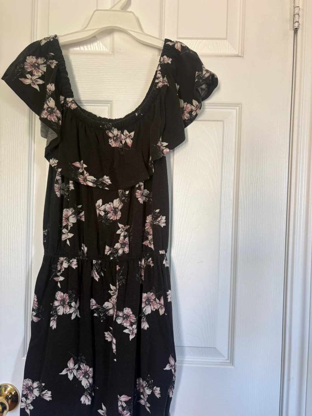 Gaines off the shoulder romper  with  a  black floral print