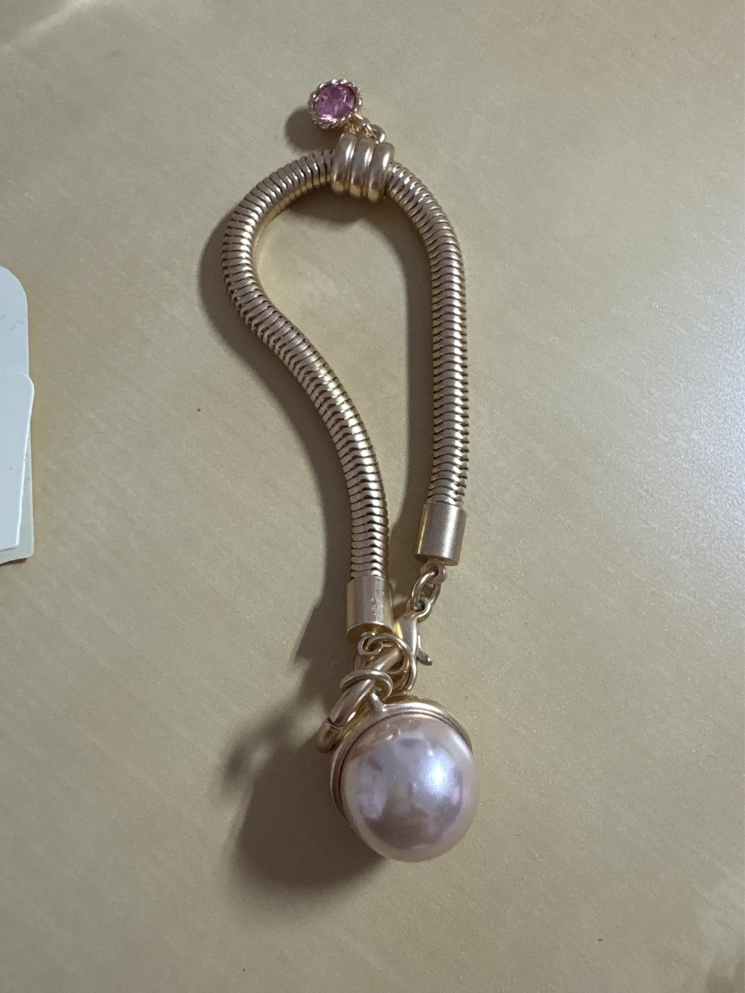 Gold-tone Bracelet with Pearl and Pink Charm
