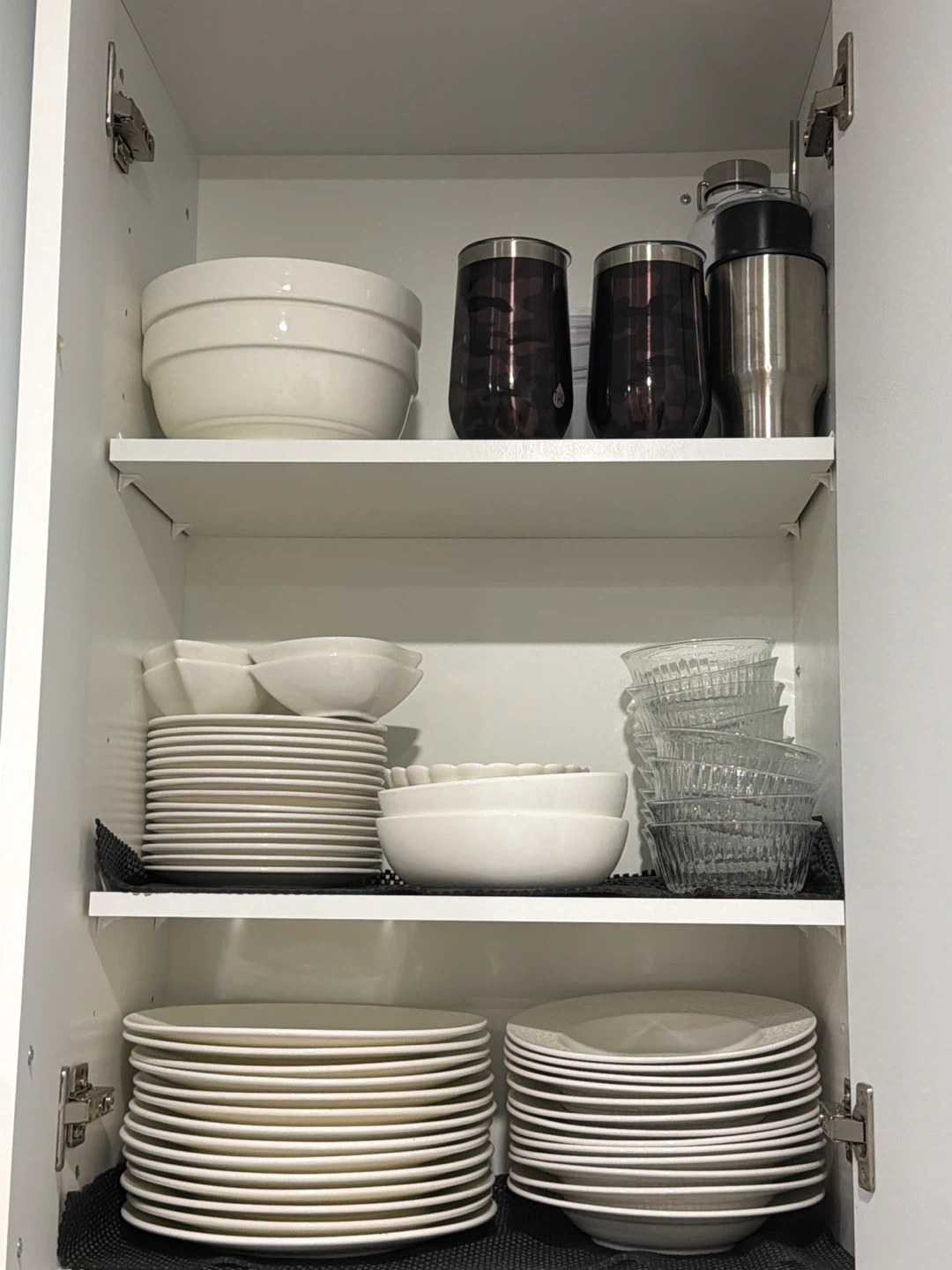 White ceramic bowls and assorted plates