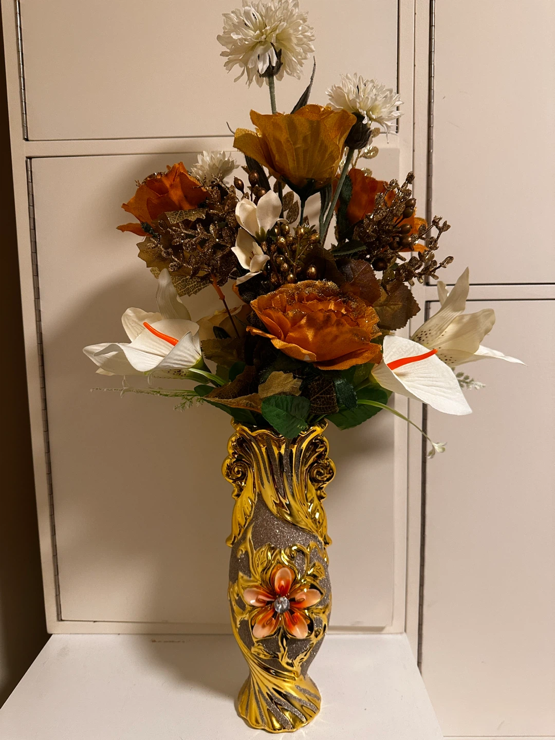 Decorative Floral Arrangement in Gold Vase
