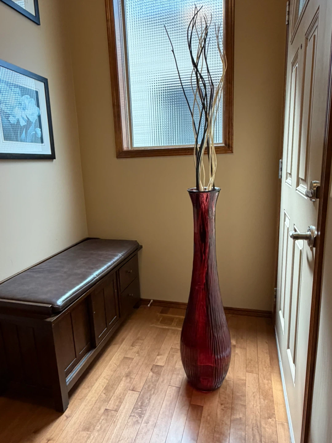 Tall Red Glass Vase with Decorative Branches