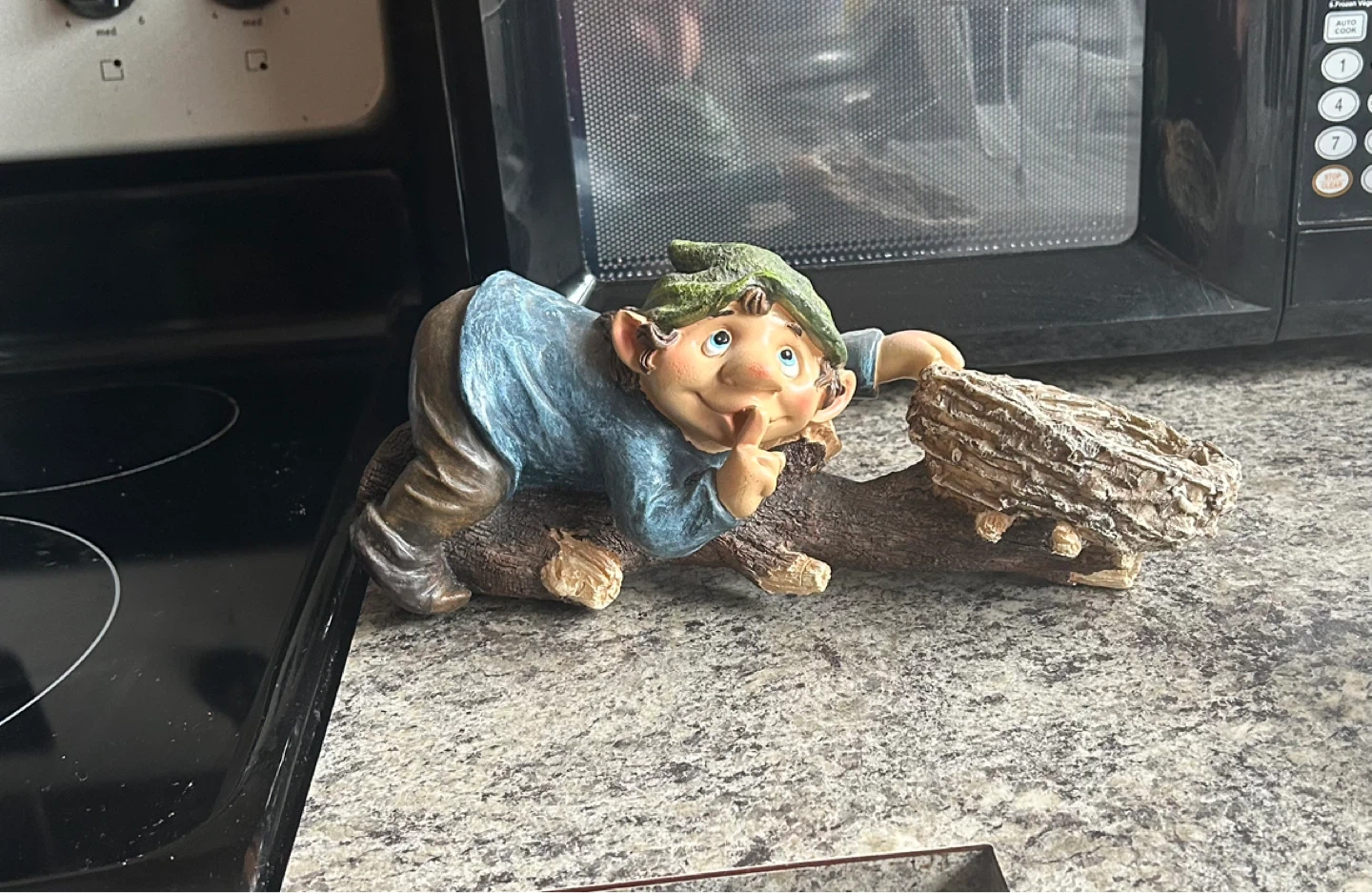 Gnome Figurine on Log ⚽