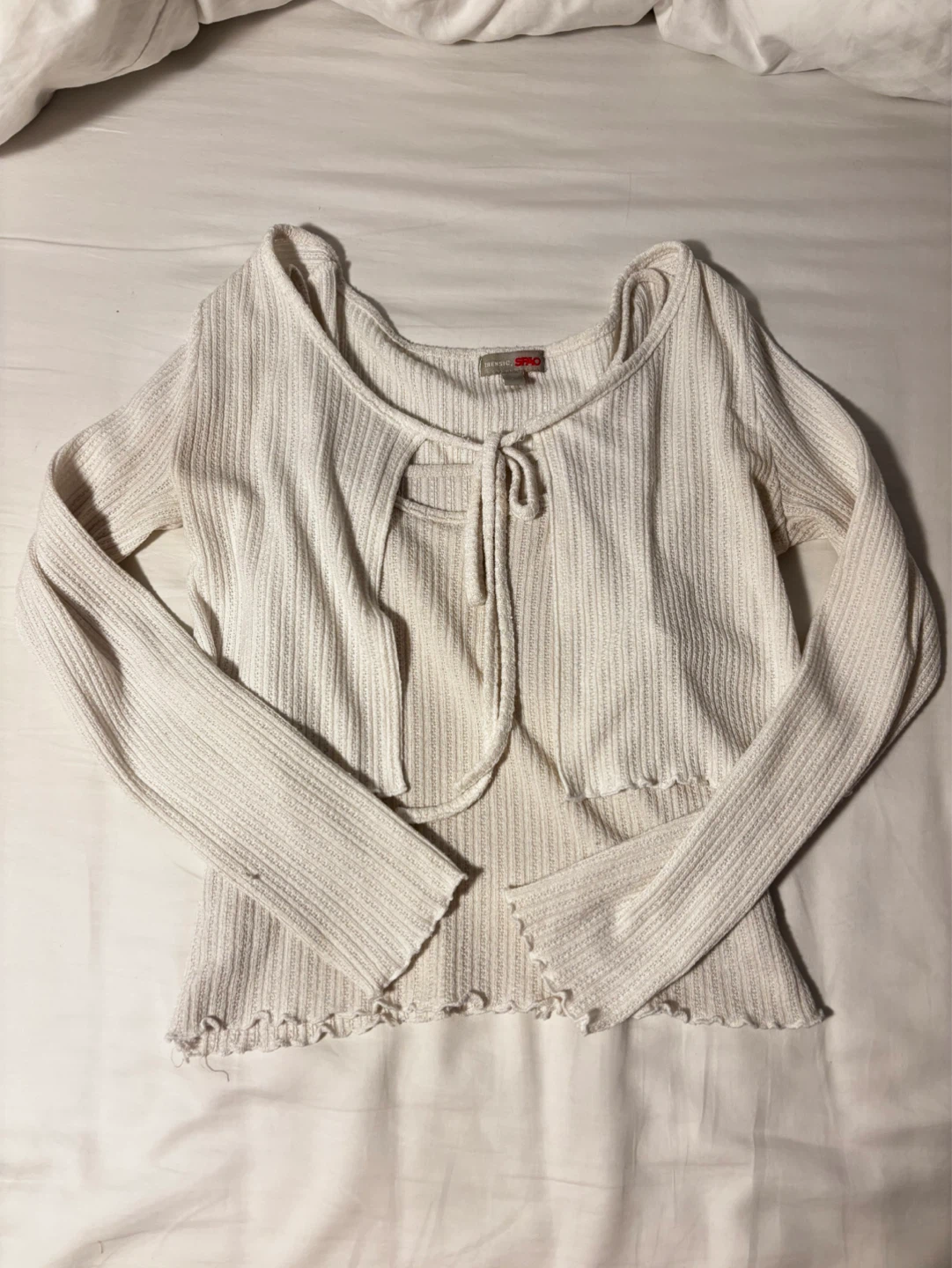 Cream-colored camisole and bolero cardigan set