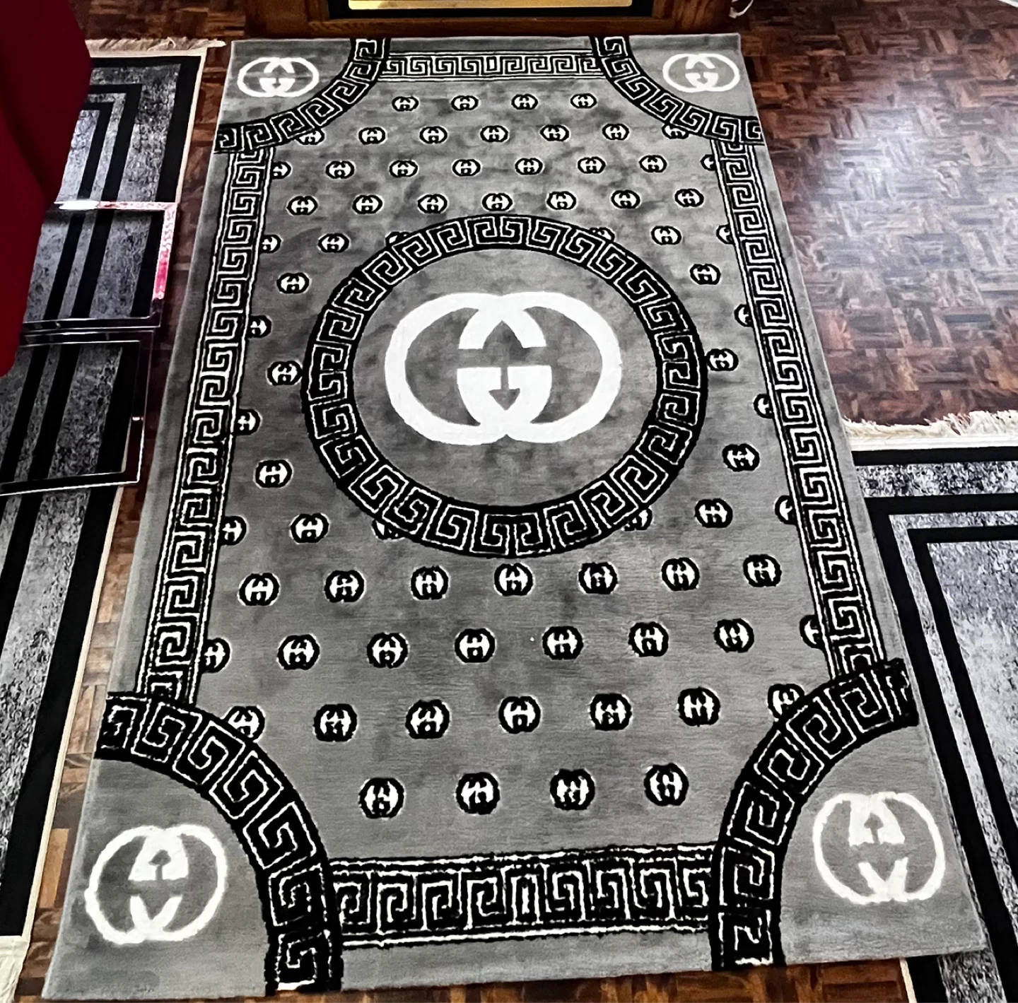 Grey Area Rug with Double G Logo Pattern