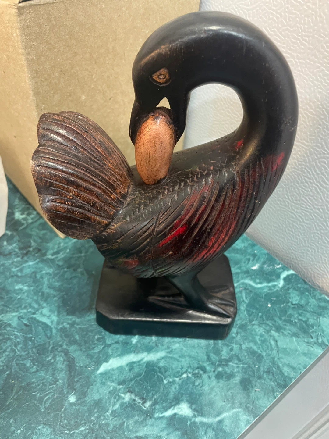 Carved Wooden Bird Figurine with Egg