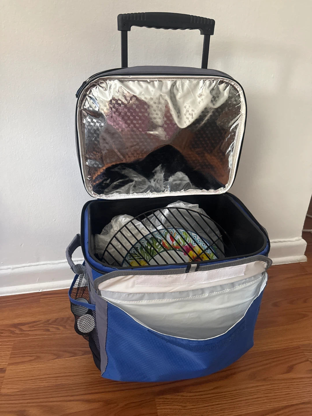 Perfect for 4th of July.  Ozark Trail Rolling Cooler Bag