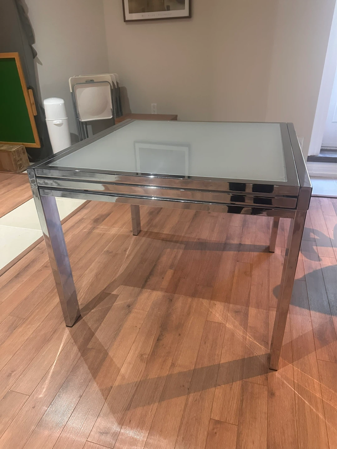 Glass top dining table with chrome frame