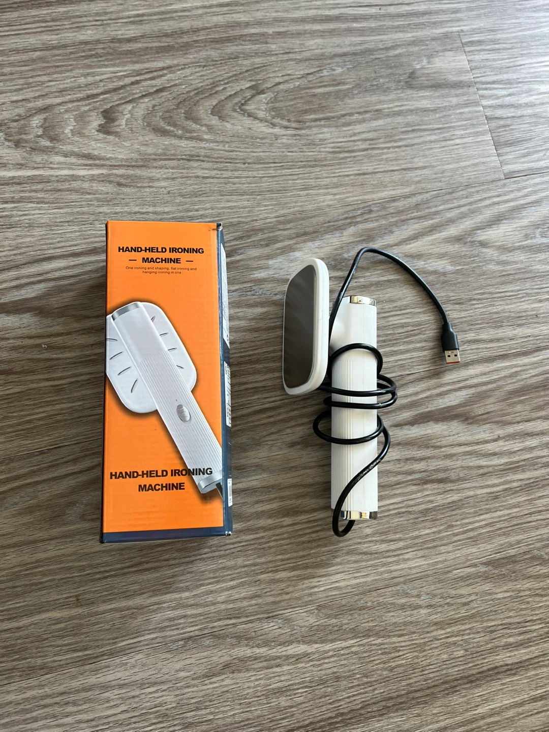 Hand-Held Ironing Machine