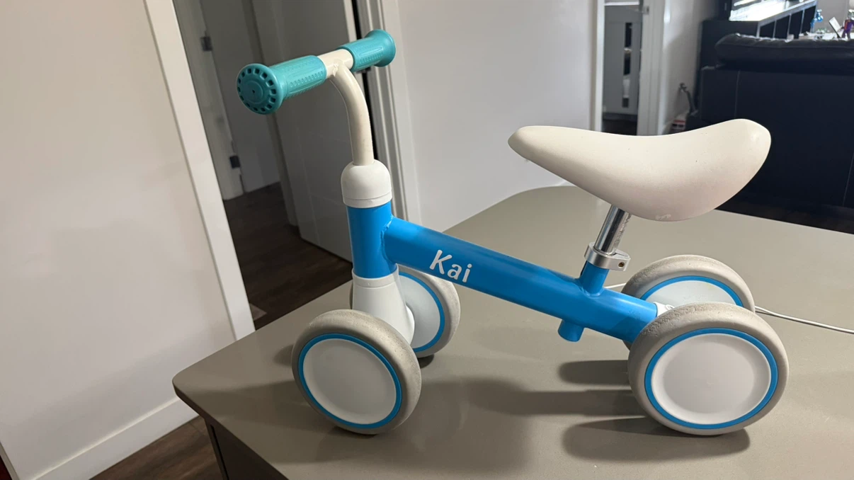 Blue Balance Bike with Kai branding