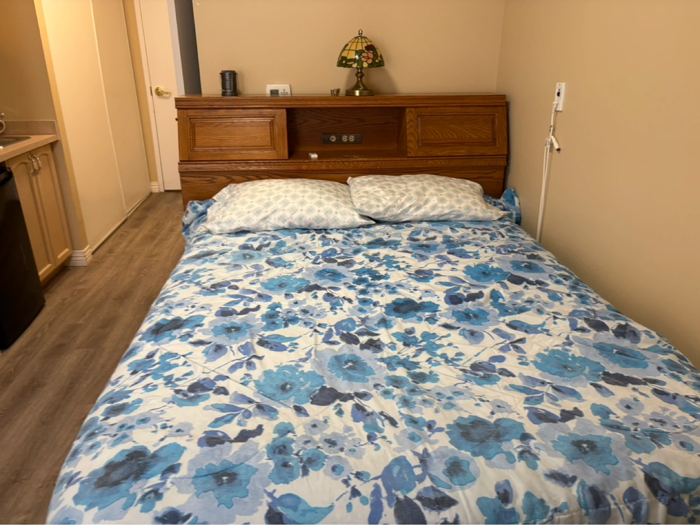 full size bed with new set of sheets and matching dresser