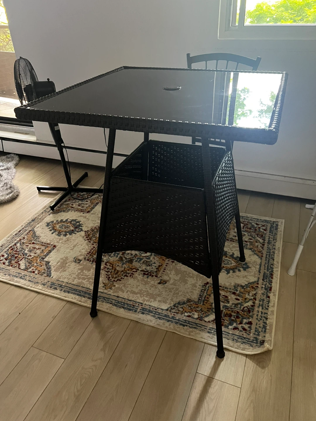 Wicker patio table with glass top