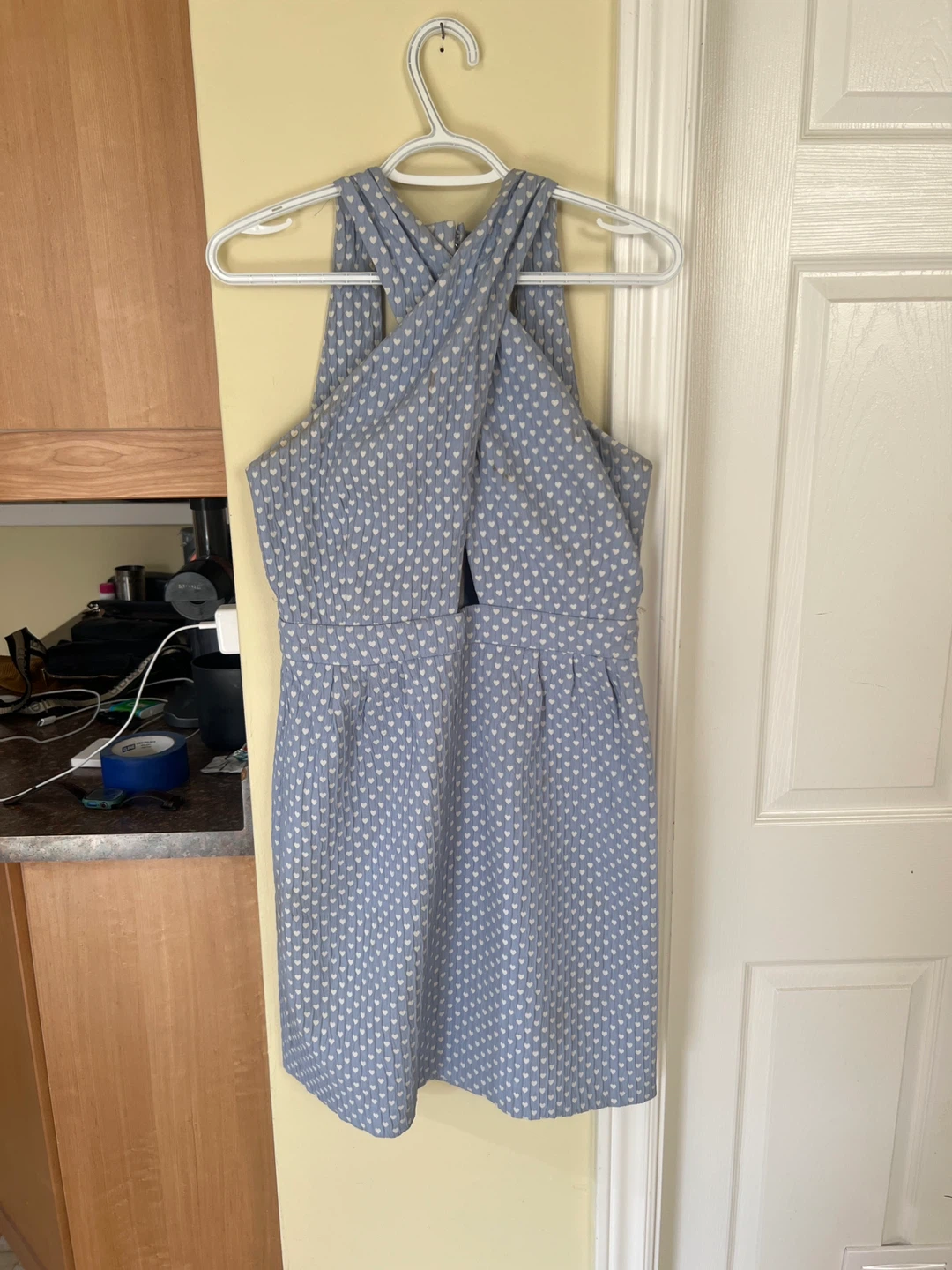 Blue patterned mini dress with criss-cross neckline