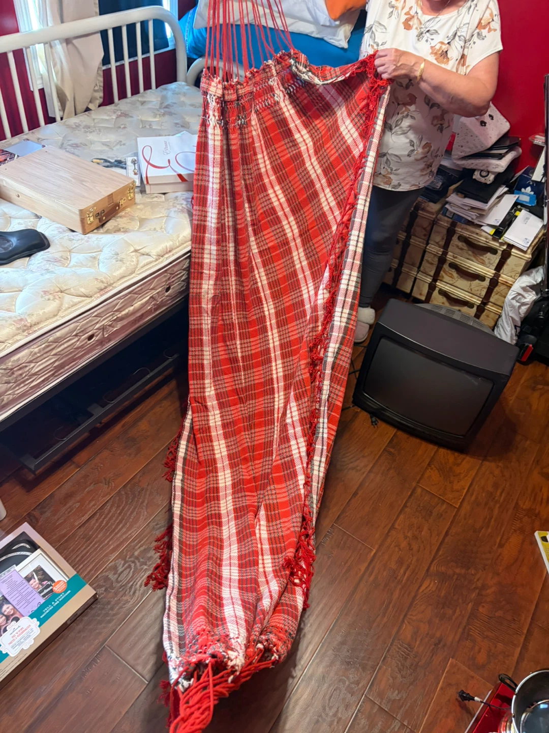 Red and white plaid hammock with fringe