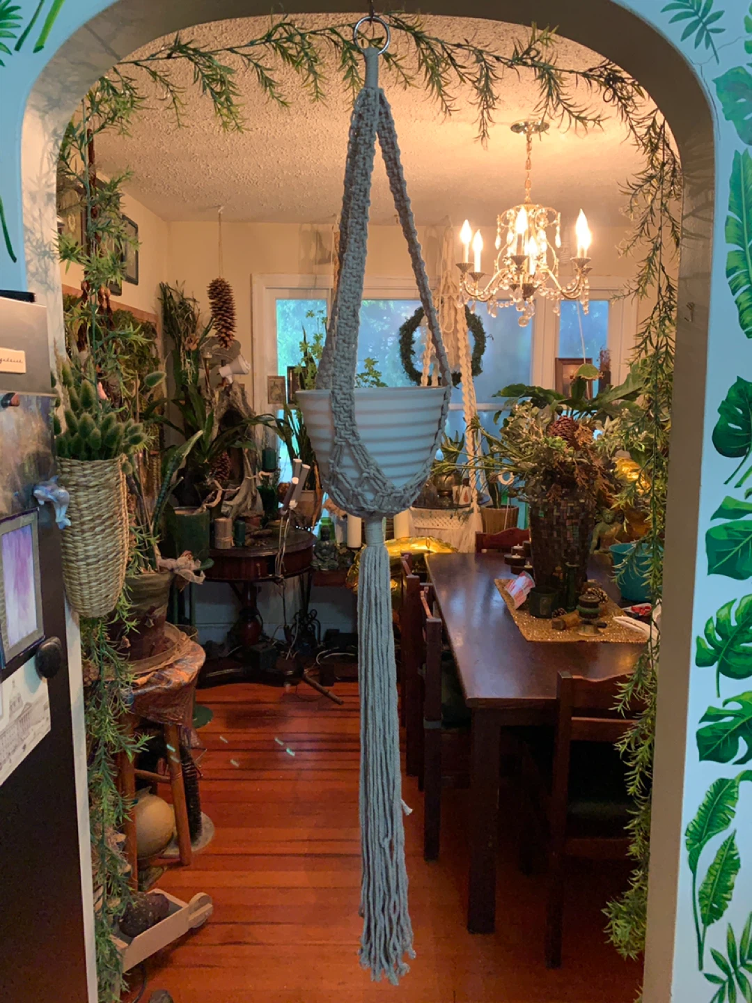 Taupe Macrame Plant Hanger with White Pot. has one twisted band.