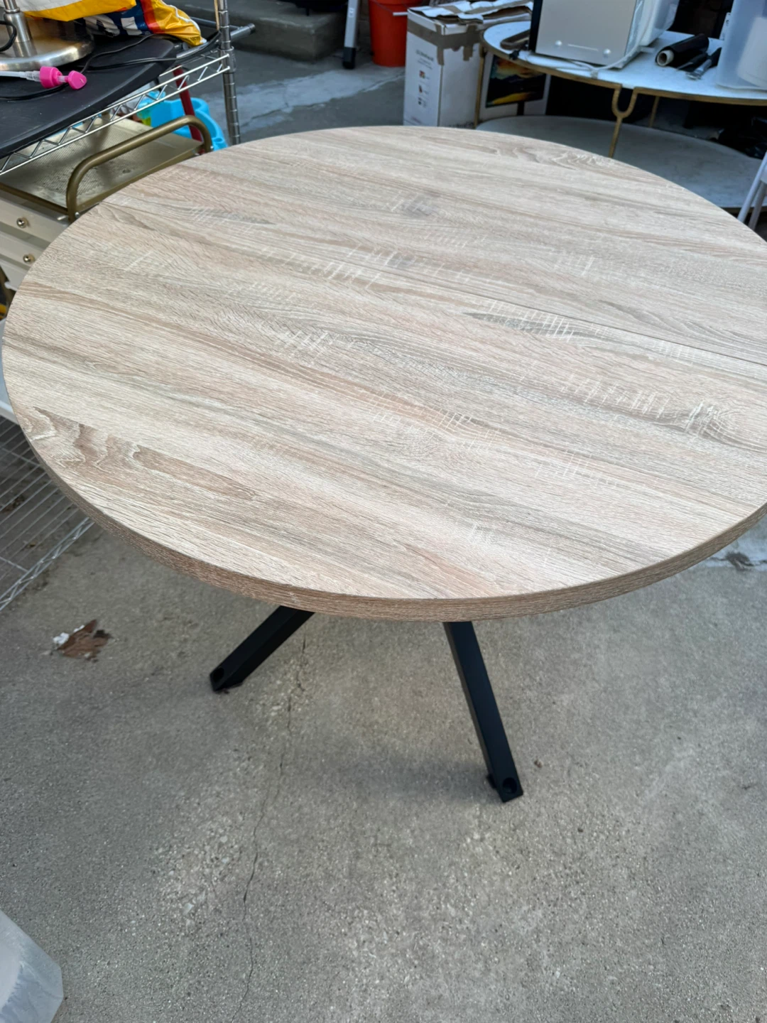 Round Woodgrain Dining Table with Black Metal Base
