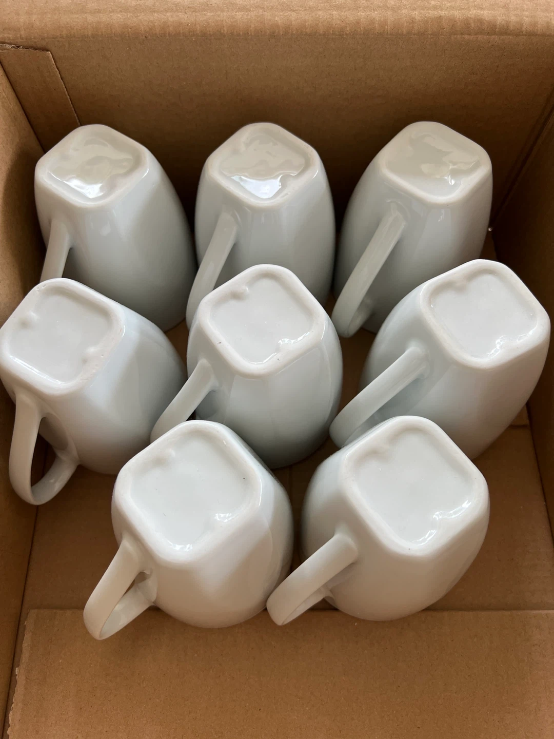 Set of 8 white ceramic mugs