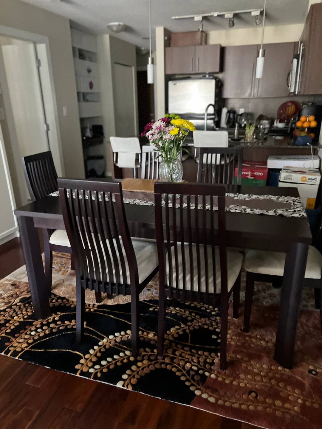 Dark brown dining table with 6 chairs with extension