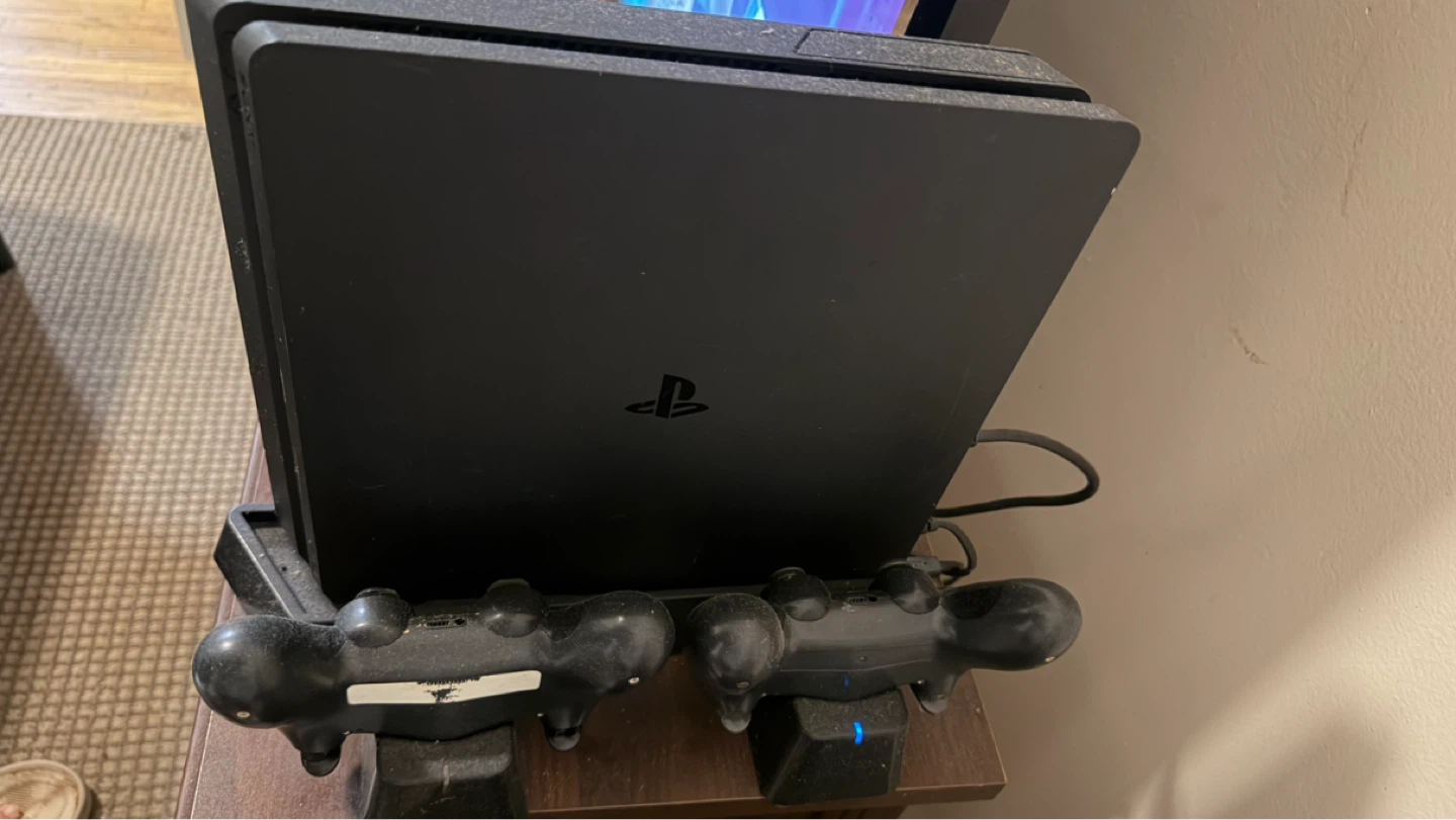 Sony PlayStation 4 Slim 1TB with Controllers and Charging Fan