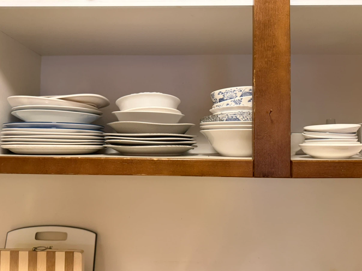 Set of white and blue patterned plates and bowls