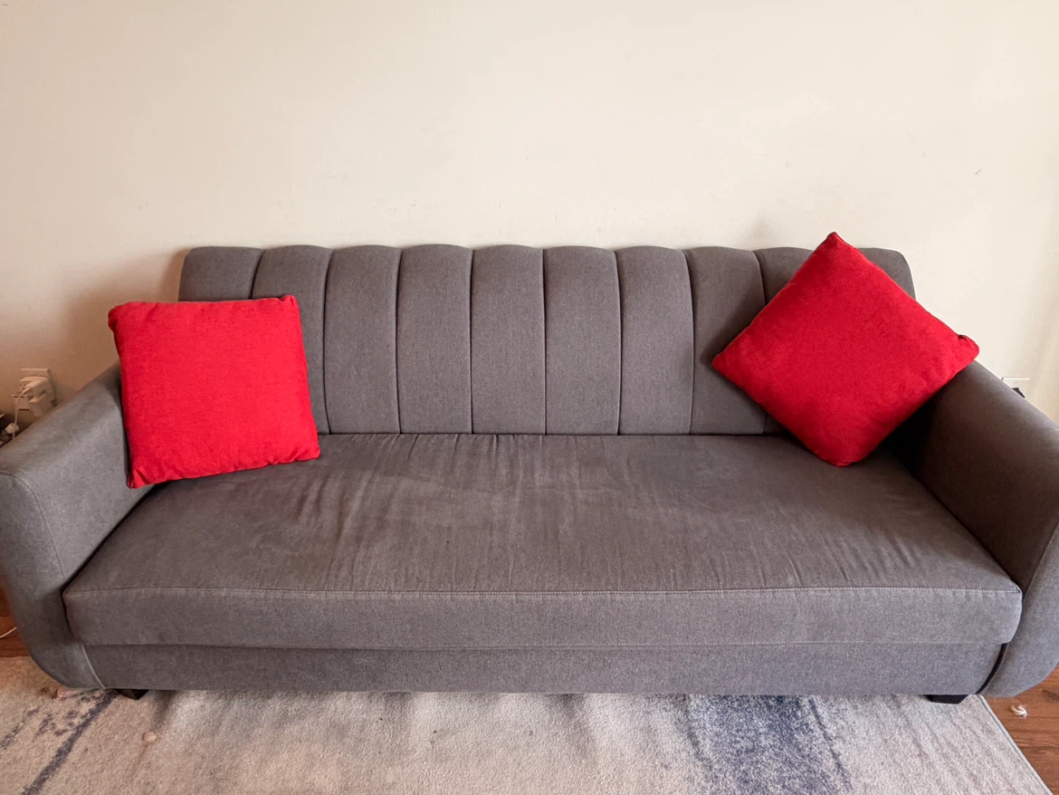 Grey Sofa with Red Pillows