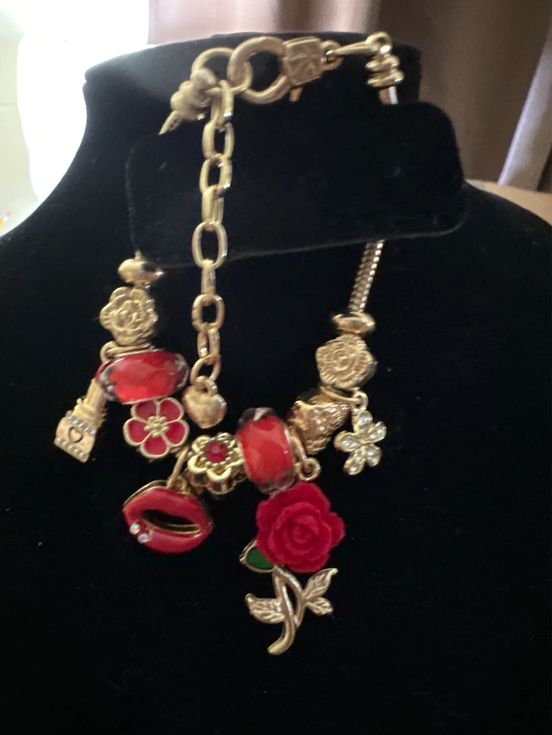 Gold Charm Bracelet with Red Accents