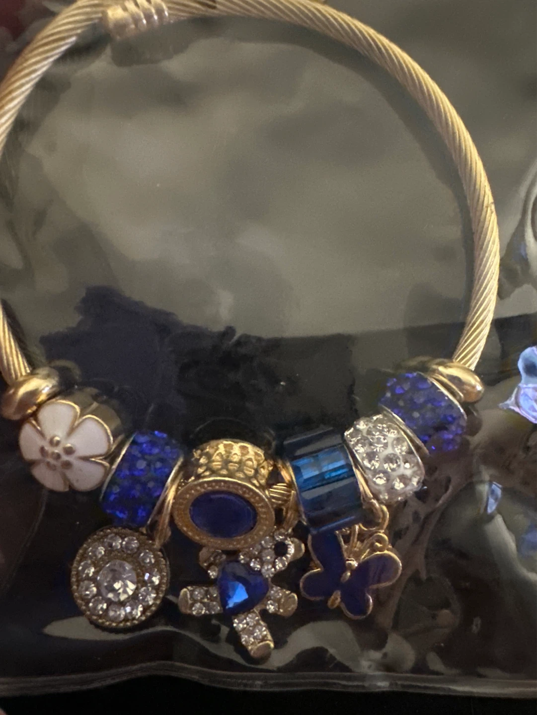 Gold Tone Charm Bracelet with Blue and Crystal Accents