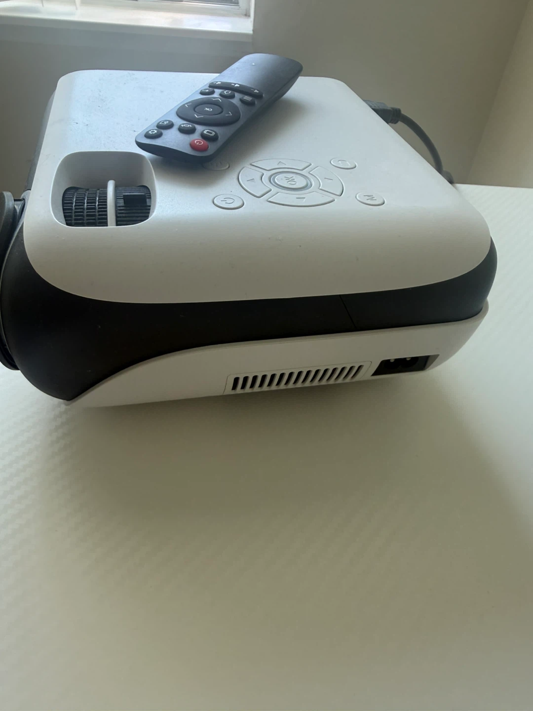White portable projector with remote - photo 2