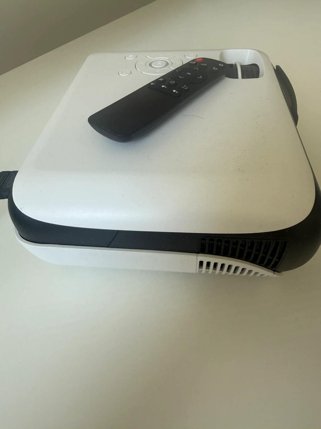White portable projector with remote - photo 3