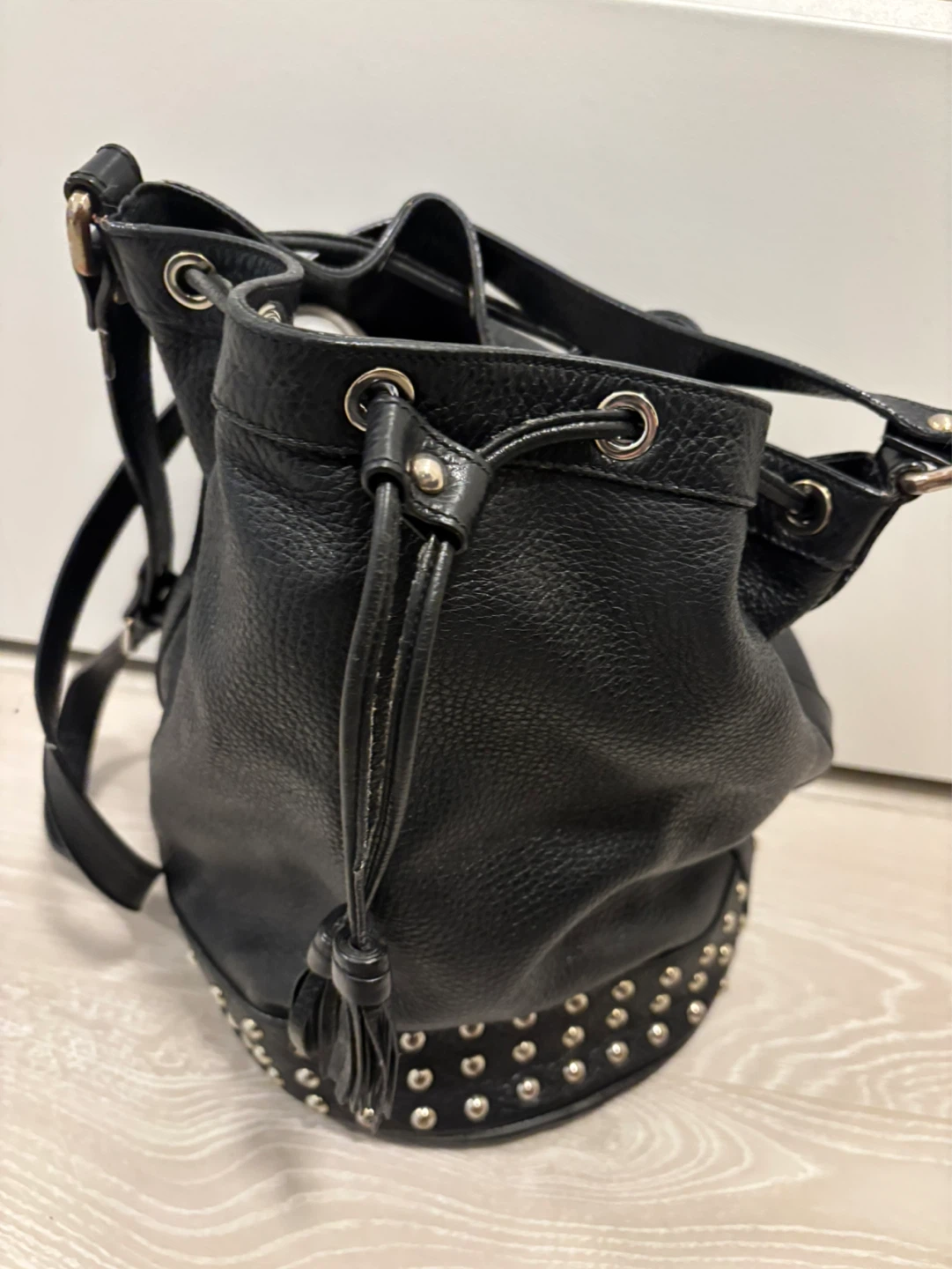 Black leather bucket bag with studs